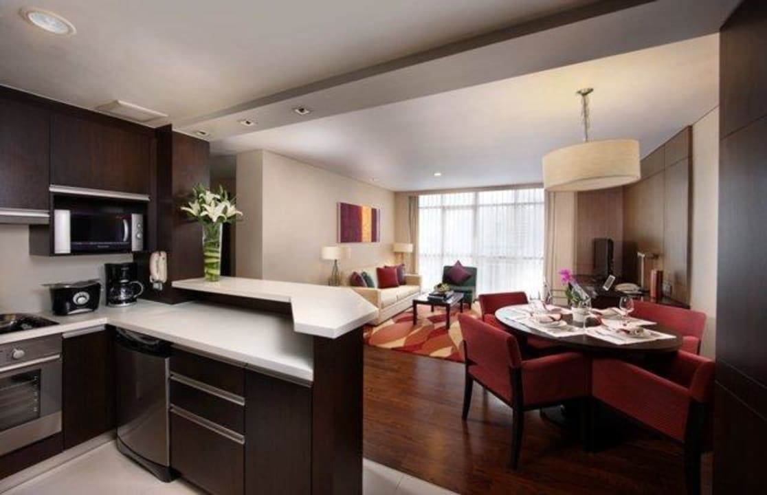 Living area with fully equipped kitchen Marriott Executive Apartments Sathorn Vista Bangkok