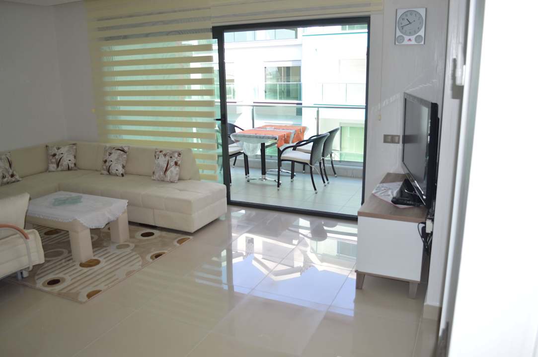 Living room and terrace Direct Beach Apartments