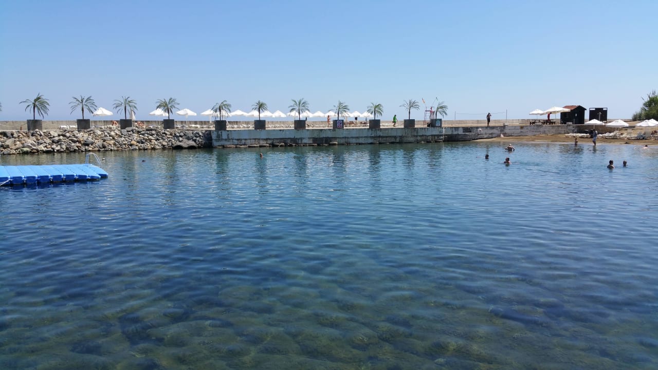 Small man made beach Oscar Resort Hotel