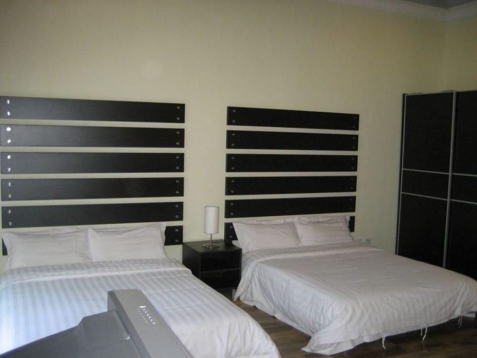 Schlafbereich Warwick International Apartments Beijing