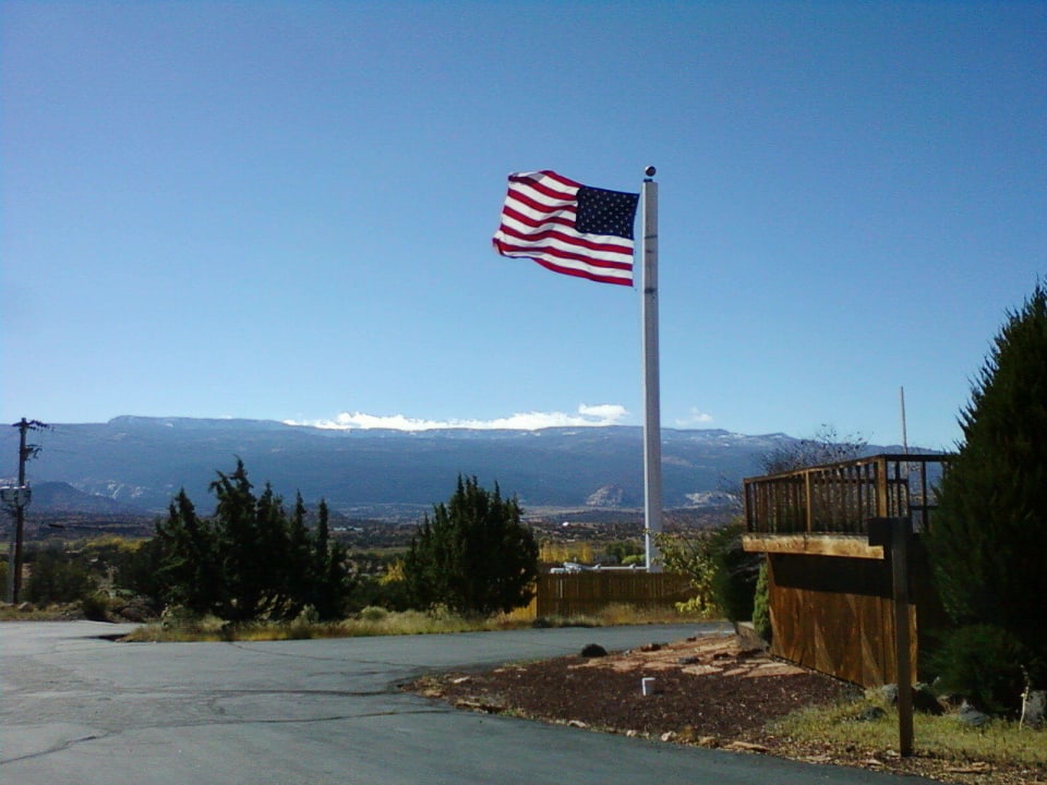 Look for the large American flag to find us Broken Spur Inn & Steakhouse