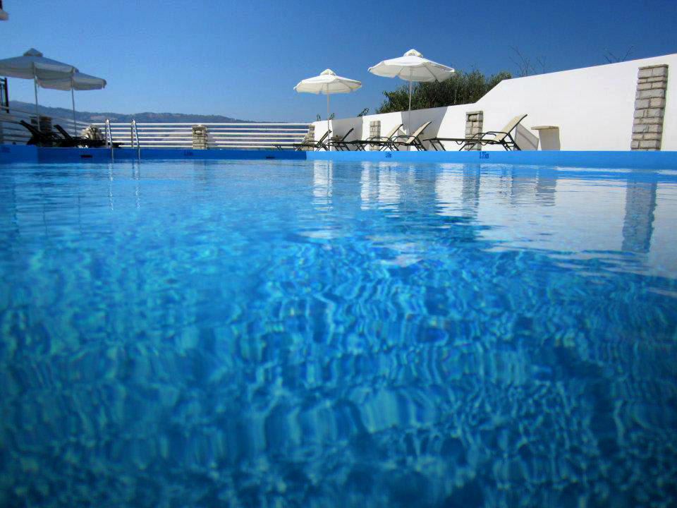 Crystal clear blue waters of the swimming pool Scorpios Hotel & Suites