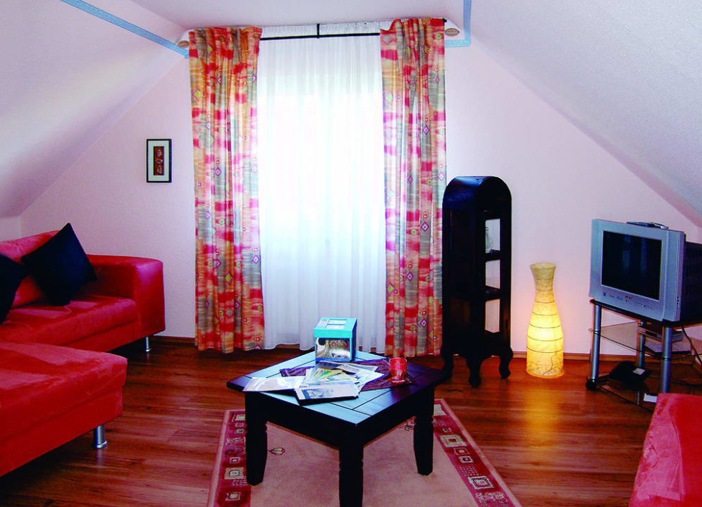 Gemütliche Sitzecke in einer Seniorsuite Hotel Garni Landhaus Uttum