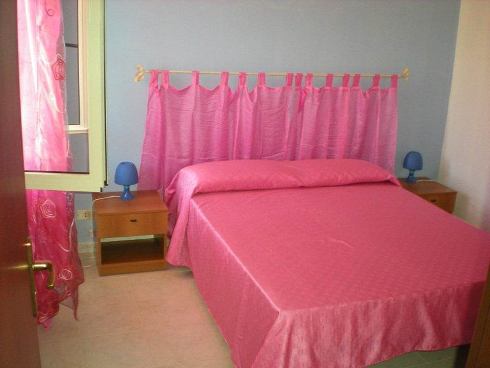 Camera da letto a tema Oasi Blu Apartment Vacanza