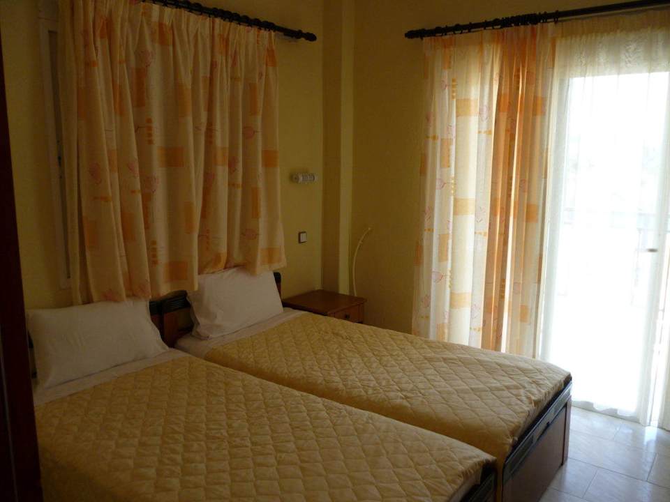 Спальня номера на 3 человека Apartment Dionisos 4