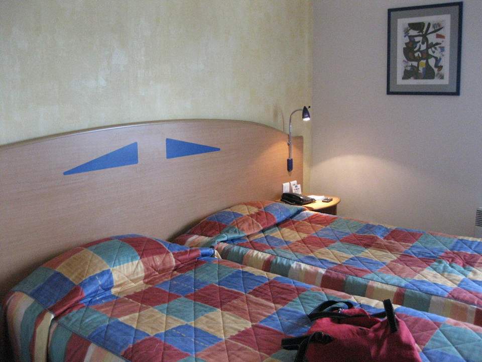 Bett im Hotelzimmer Hotel Pavillion d'Italie