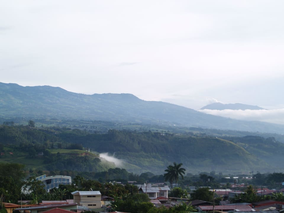 View from the balcony with volcanoes Hotel Orosi Lodge