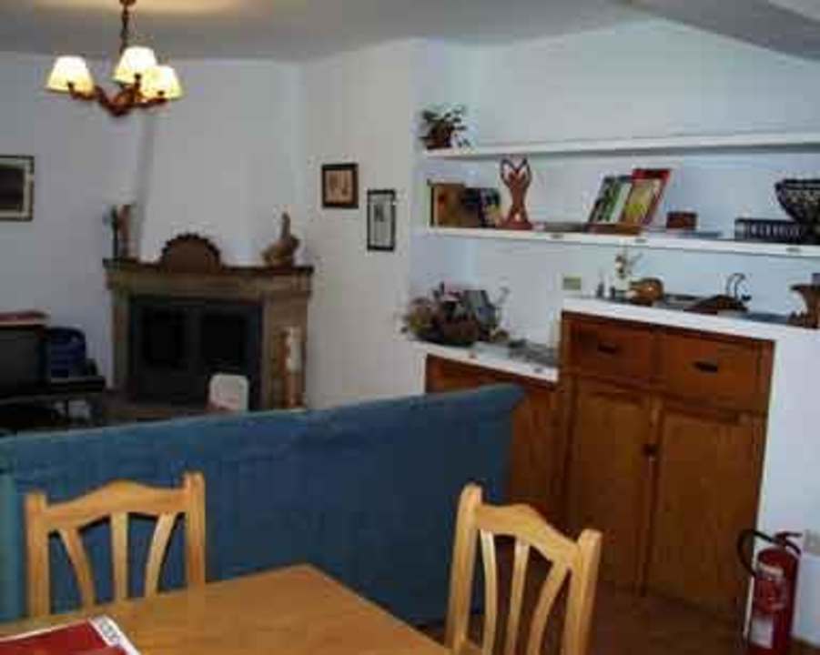 Sala de Estar con Chimenea Hostal Río Mundo