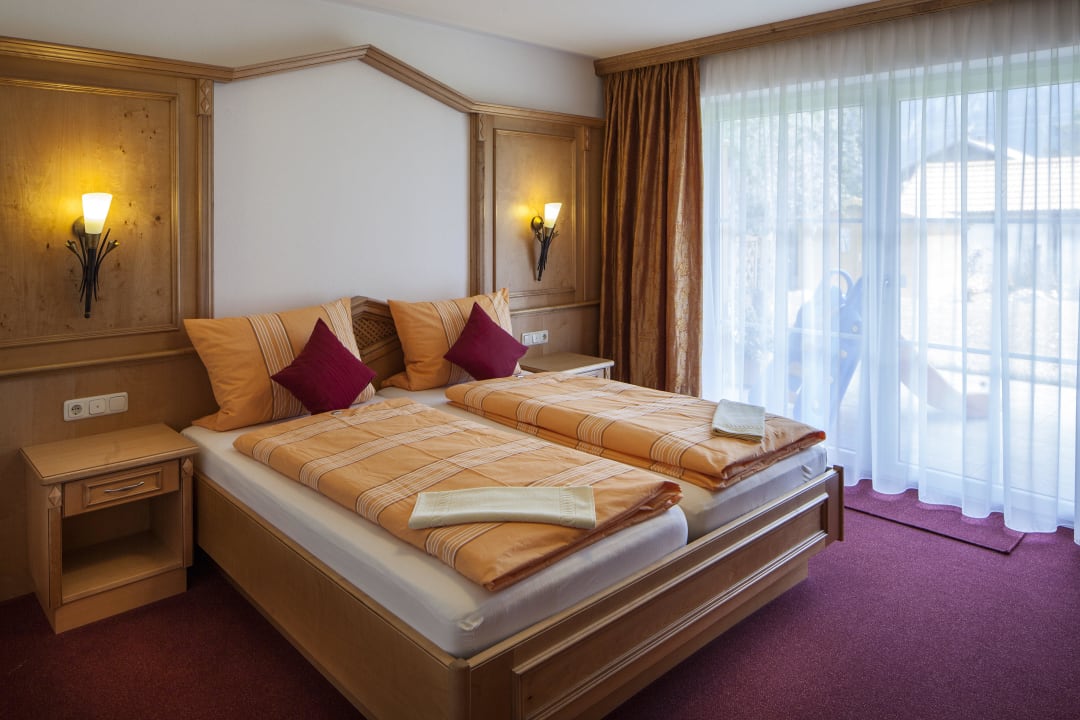 Wohnung Enzian - Schlafzimmer mit Doppelbett Ferienhaus Abendrot