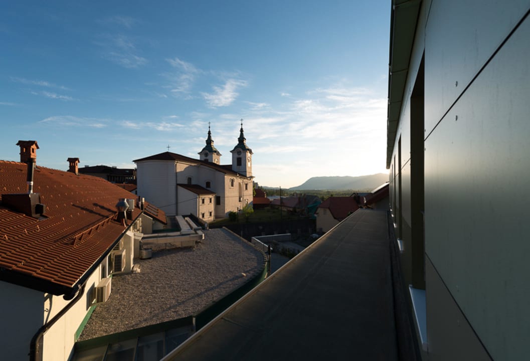 View of the nearby church Postojna cave Rooms & Apartments Proteus
