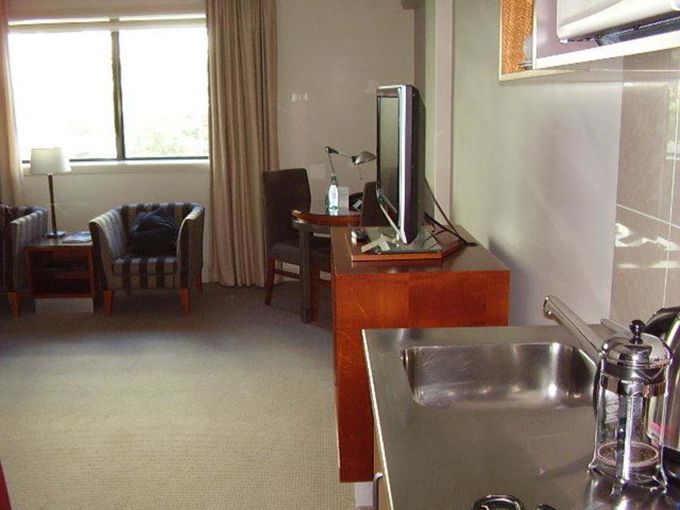 Kitchenette and room Hotel The Sebel Suites