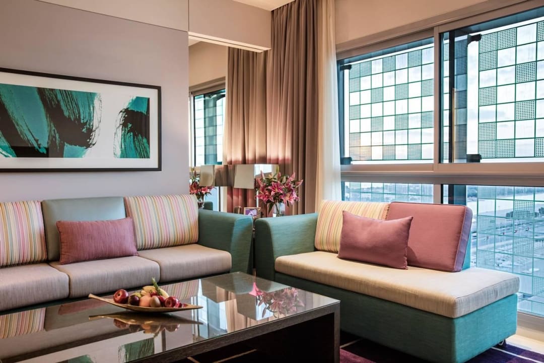 Deluxe one bedroom suite - Living room Capital Centre Arjaan by Rotana