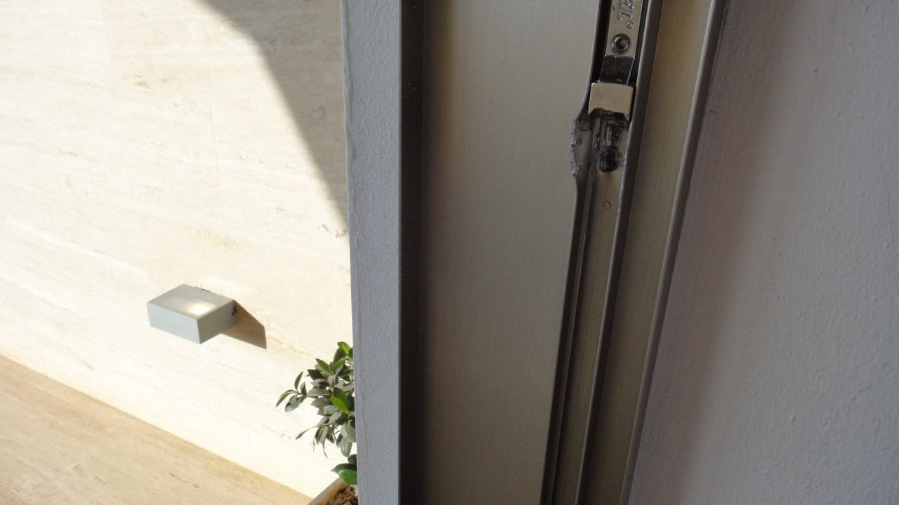 Signs of breaking in (terrace) Asterias Beach