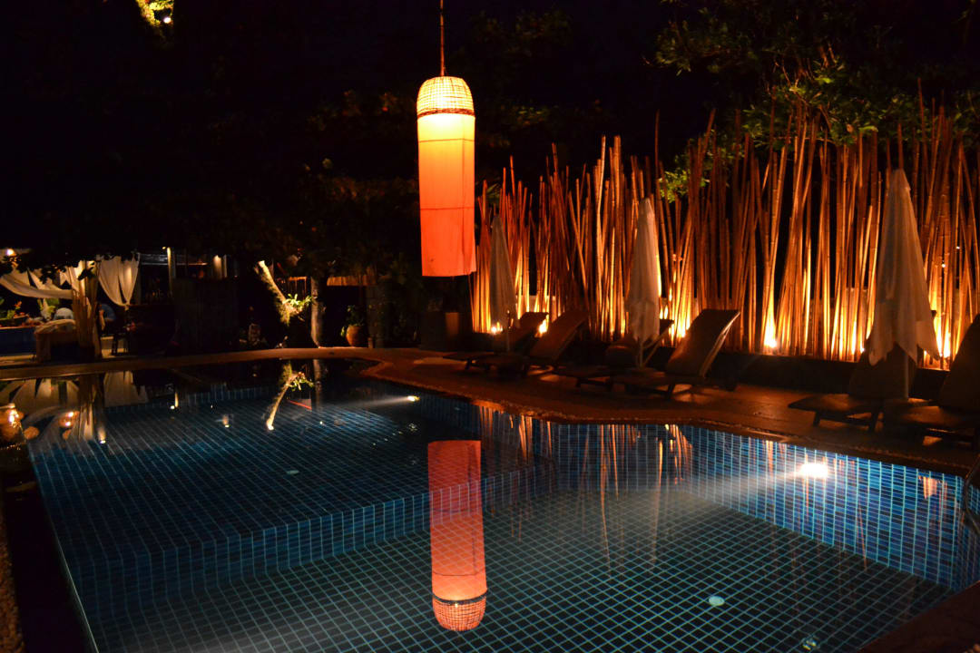 Pool by night Ocean Breeze Resort