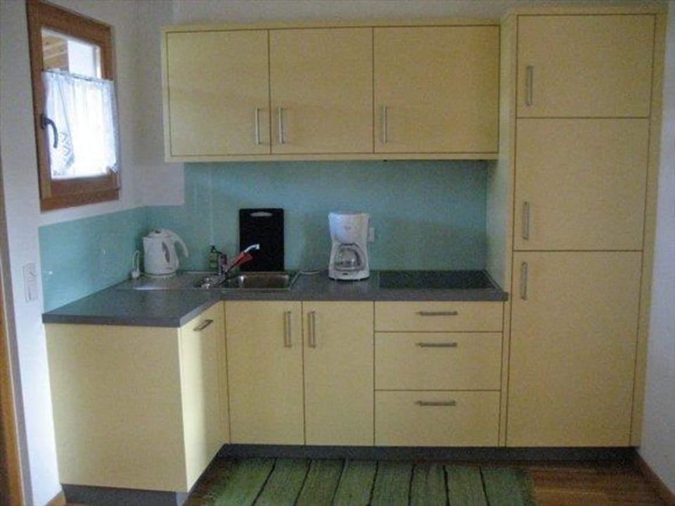 Die Küche des Apartments Apartments Sun