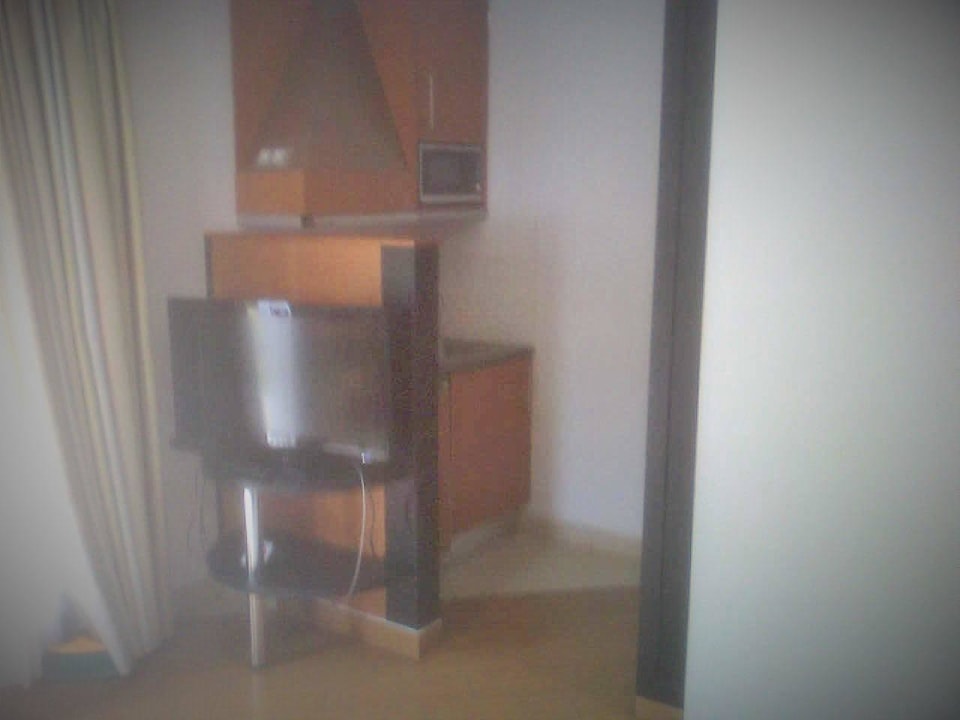 TV und Kitchenette HL Miraflor Suites Hotel