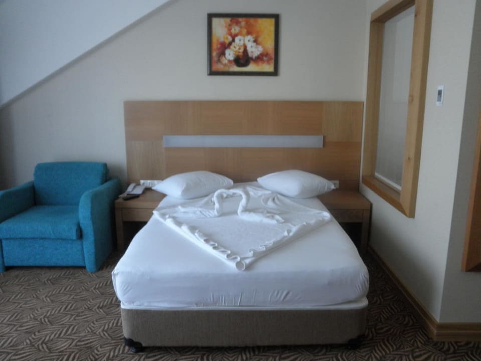 Das Bett im Deluxezimmer Saphir Hotel & Villas