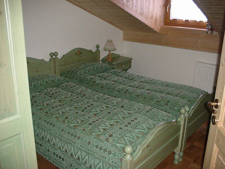 Letto 2 - Mansarda trilocale Bachlaufen Haus Casa Vacanze