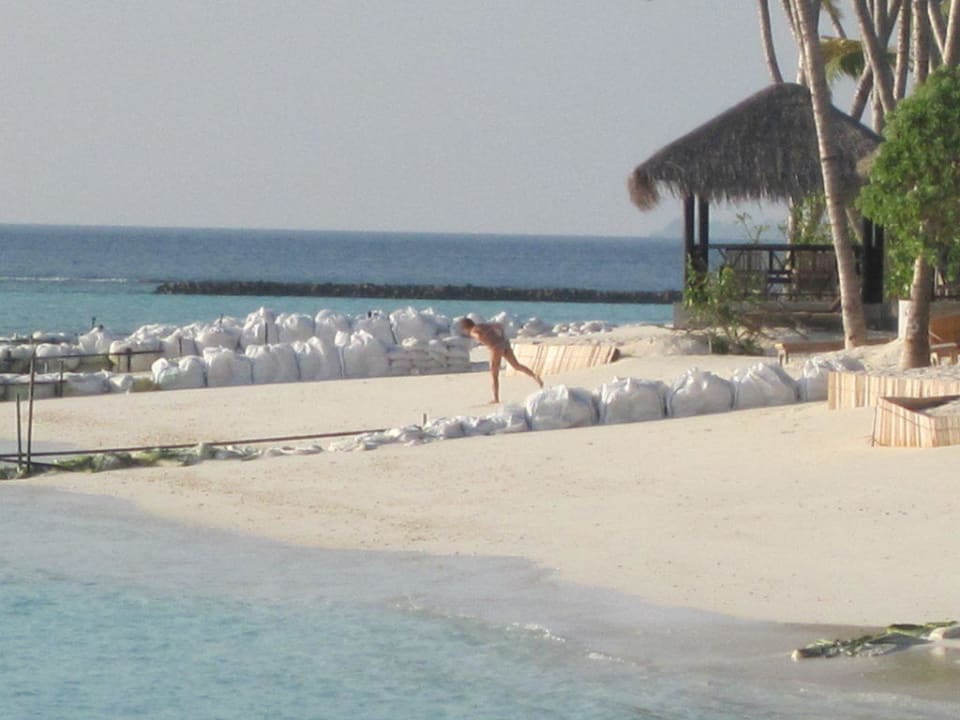 Sandbags in front of beach villas Sun Siyam Iru Fushi