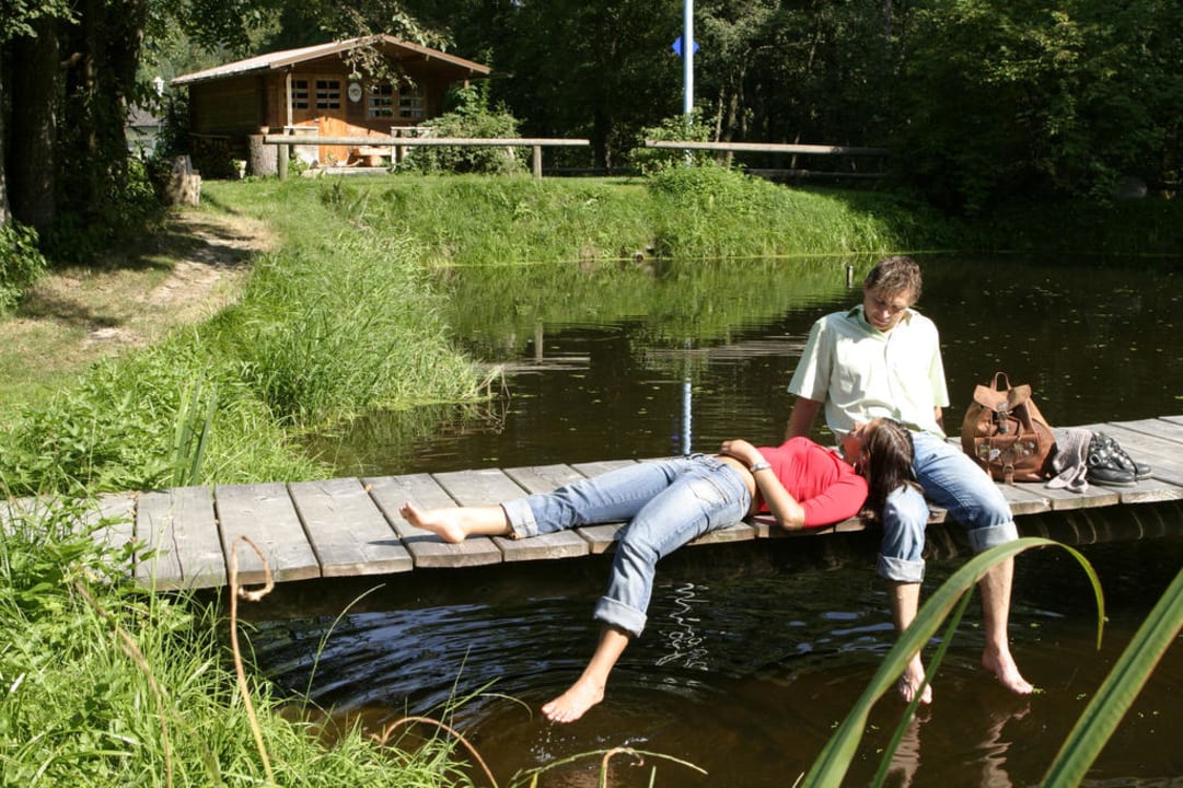 Am Steg unseres Forellenteiches Landhotel Koller