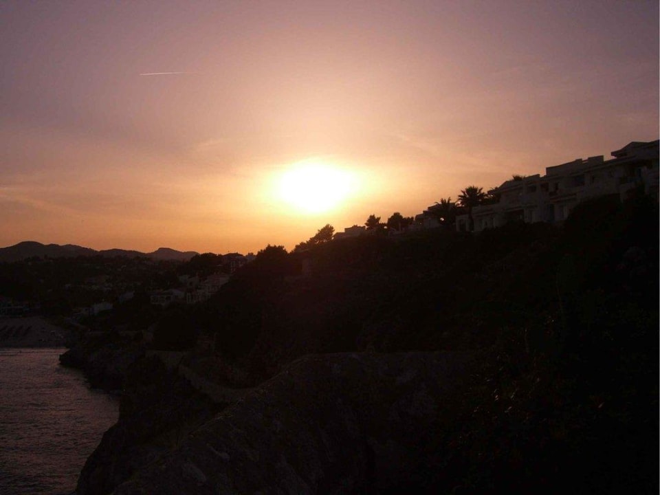 Sonnenuntergang an der Cala Romantica blau punta reina
