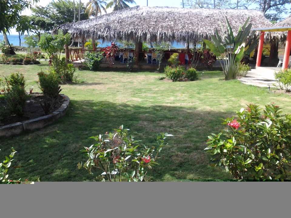 View of gardens and restaurant Beach Hotel Bahia De Los Dioses