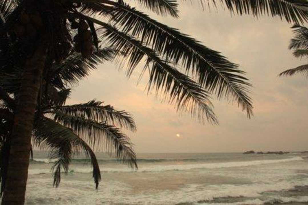 Sunset and beach Hotel Time & Tide Beach Resort