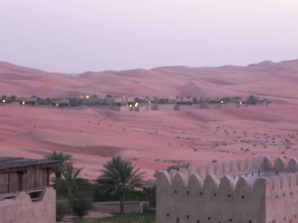 The hotel at night Qasr Al Sarab Desert Resort by Anantara