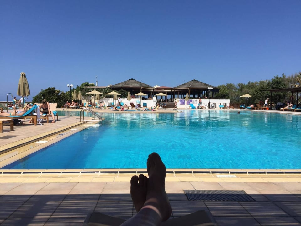 At the main swimming pool Apollonia Beach Resort & Spa
