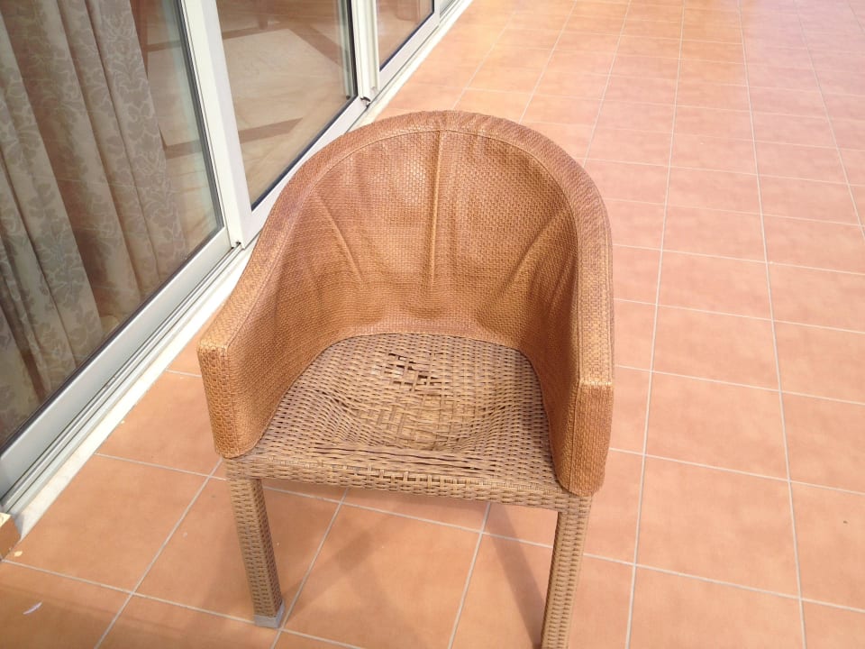 Arm chair in a poor condition on one terrace Seaside A Lifestyle Resort