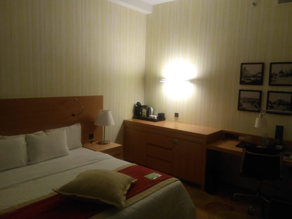 Table and bed with coffe machine Courtyard Hotel Budapest City Center