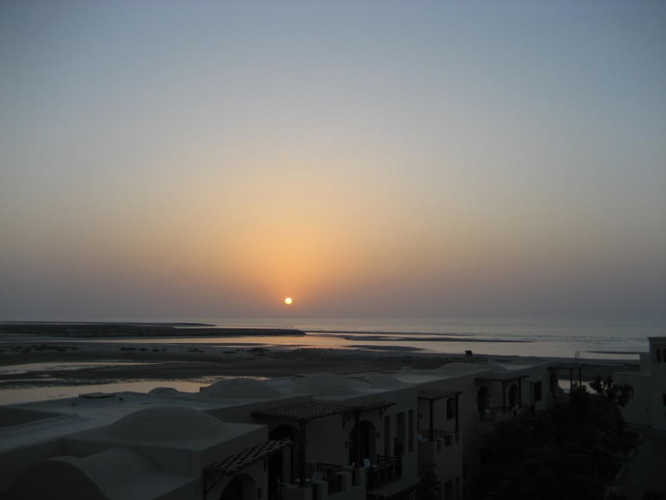 Sonnenuntergang von unserem Zimmer The Cove Rotana Resort