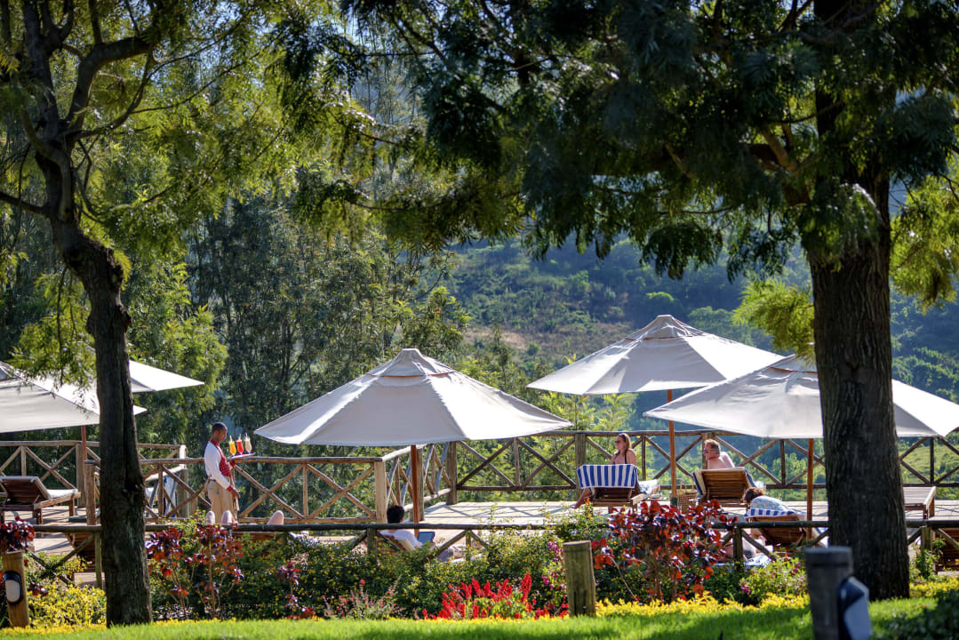 Relax at the swimming pool after a safari Neptune Ngorongoro Luxury  Lodge