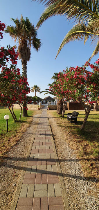 Gartenanlage HARPIN Happy Days Beach Hotel