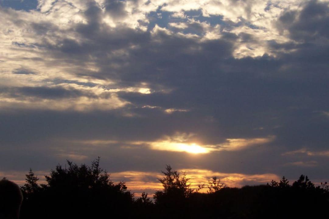Sonnenuntergang auf der Terrasse Ferienwohnungen in Söndervig