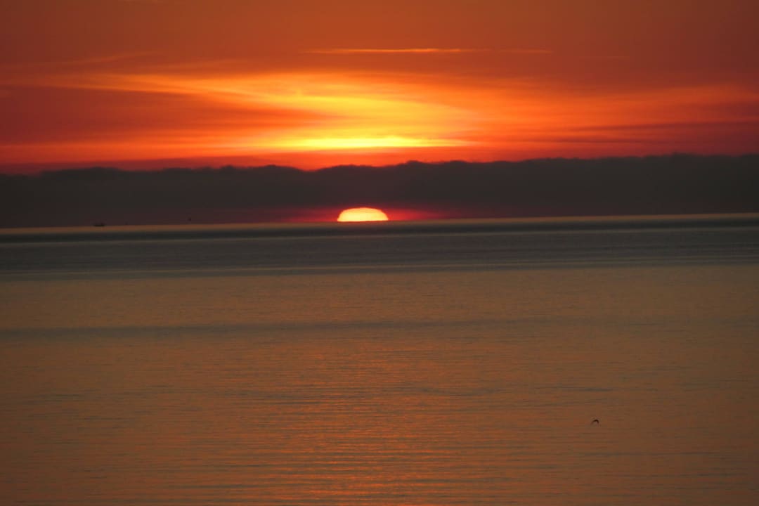 Sonnenaufgang über dem Meer CM Playa del Moro