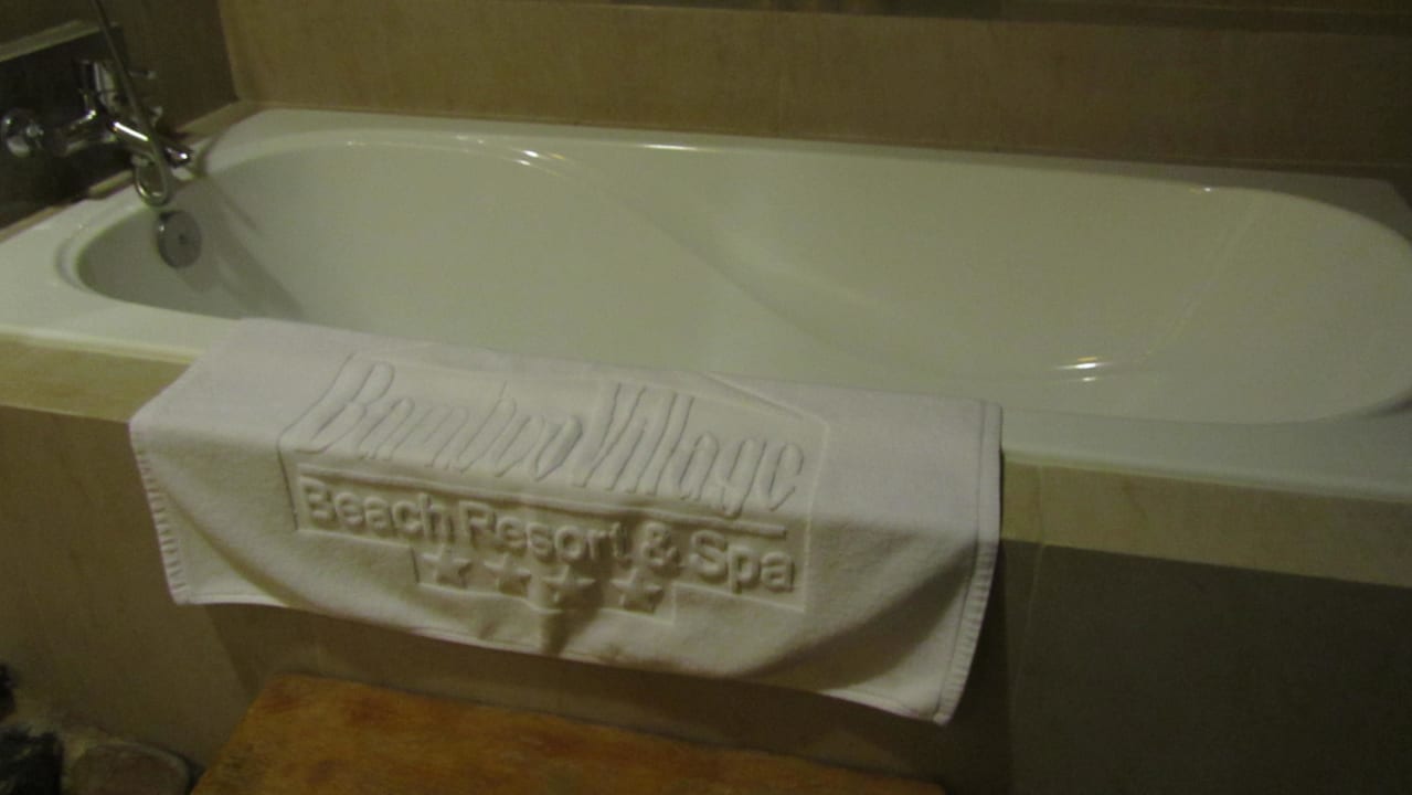 Tub and towel Bamboo Village Beach Resort & Spa