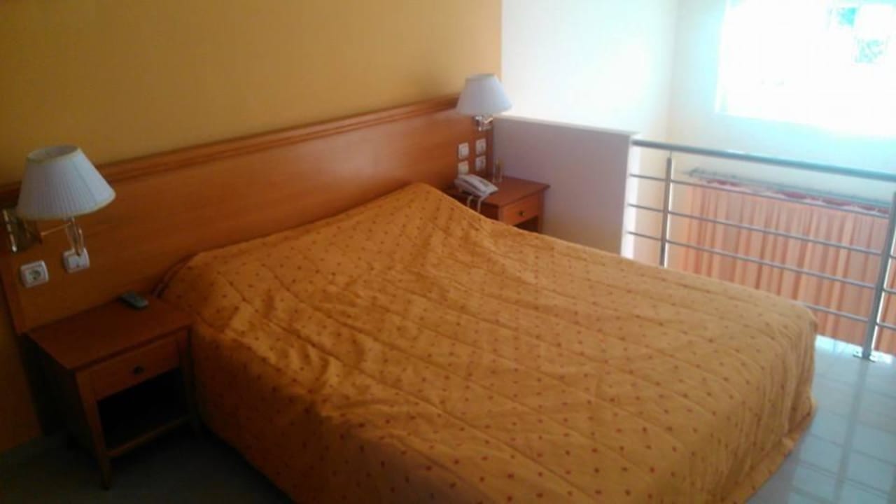 Łóżko w pokoju nr 5 Hotel Apartments Ionio Star