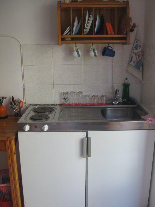 The studios include kitchenette with fridge Machi's Guest House