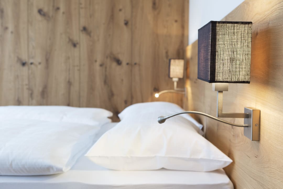 Bett im Zimmer Alpengasthof Filzstein