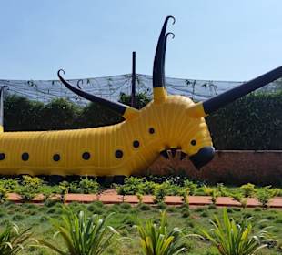 Giant Caterpillar sculpture at front entrance