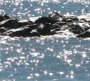 Wasserreflektion am Duque Strand