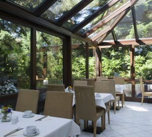 Wintergarten und Frühstücksbereich