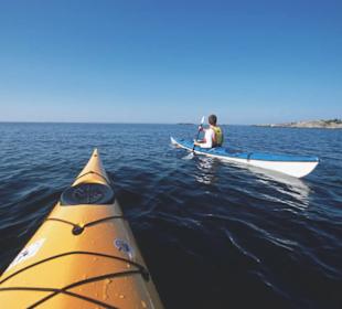 Embark in the Swedish archipelago with a kayak.