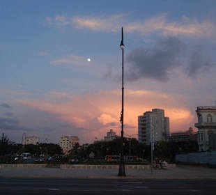 At the far end of the Malecon