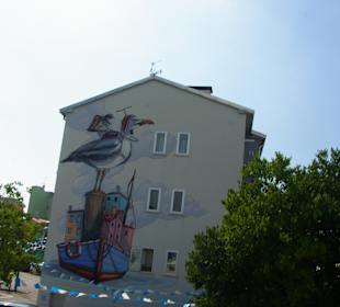 Die Hausbilder am Parkplatz