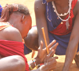 Maasai original way of making fire with cow waste