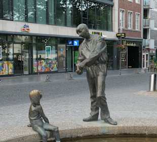 Kreislauf des Geldes, Brunnen beim Elisengarten