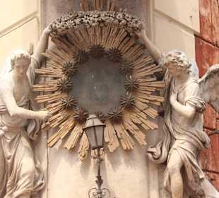 To the right of Trevi Fountain