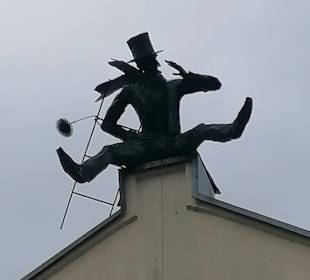 Schornsteinfeger auf dem Dach
